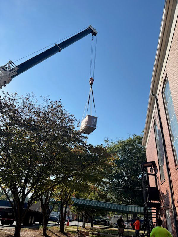 crane-lifting-AC-unit-to-the-roof-of-the-church-in-Brookhave-GA