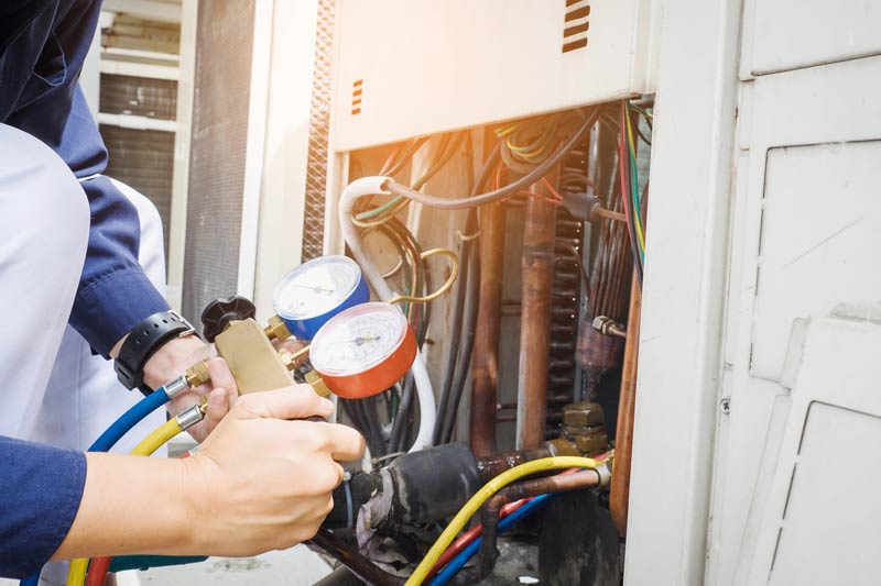 hvac-technician-is-checking-air-conditioner