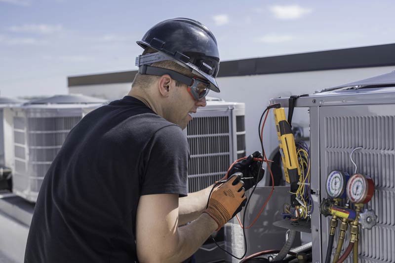 hvac-technician-repairing-office-ac-unit