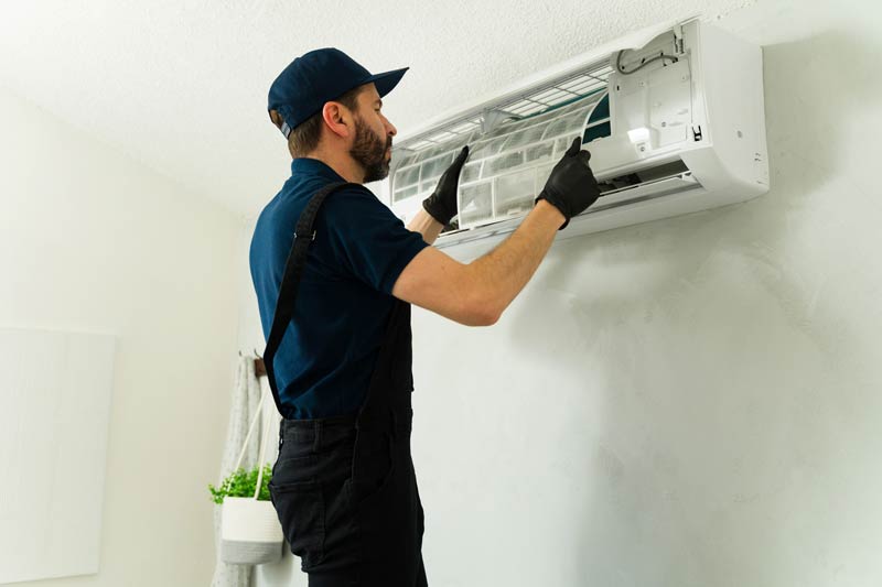 male-technician-wearing-gloves-cleaning