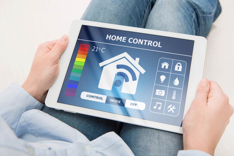 woman-holding-digital-tablet-with-home-smart-system